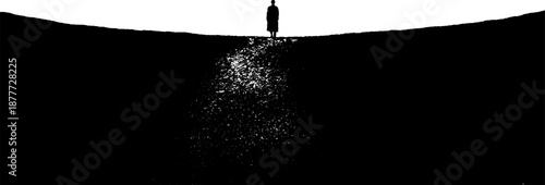 Silhouette of a lone figure on a hilltop against bright sky