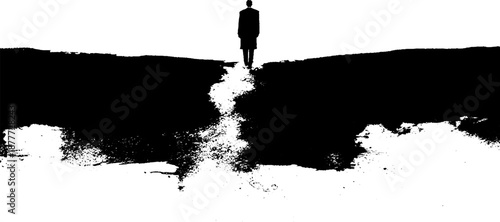 Silhouette of male standing on edge of abstract path in black and white