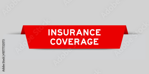 Red color inserted label with word insurance coverage on gray background