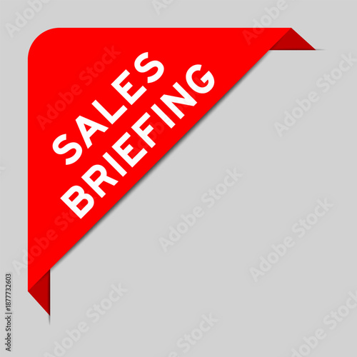 Red color of corner label banner with word sales briefing on gray background
