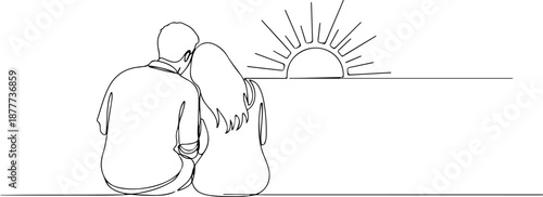 Couple sitting together watching sunset