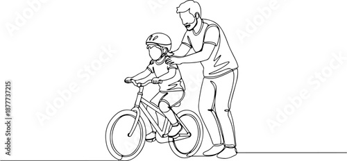 Father teaching son to ride bicycle