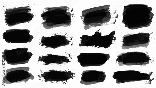 A large collection of black grunge brush strokes and paint splotches isolated on a white background