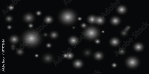 Glowing white orbs on black background