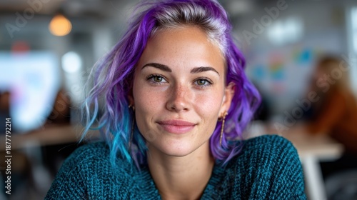 Wallpaper Mural A young woman with vibrant purple and blue hair smiles confidently in a modern workspace filled with people, representing creativity and individuality in today's work culture. Torontodigital.ca