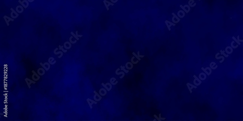 Abstract blue powder explosion cloud on dark background. Deep blue textured abstract background. Dark blue leather texture background. old blue background.
