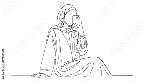 Woman in hijab sitting with smartphone