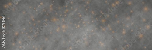 «Freeze motion shot of golden glitter in mist isolated on black background.»