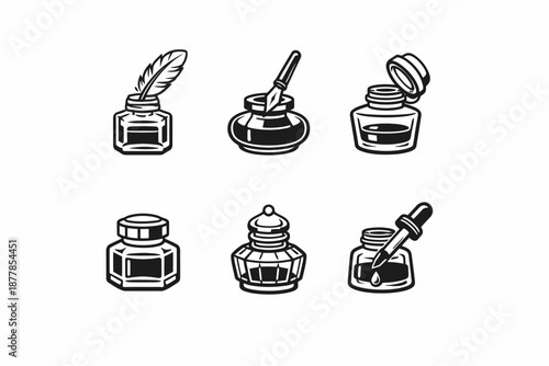 Vintage ink bottles collection with feather quill and brushes on white background