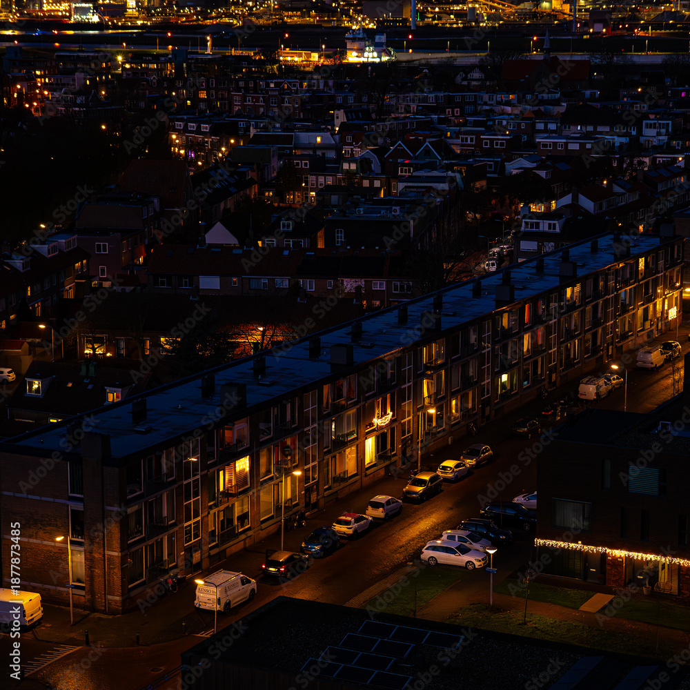Obraz premium Ijmuiden Netherlands aerial view at night. Old dancing houses, canals, river channel and ships, canals with bridges, old european city landscape from above.