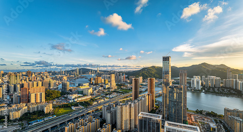 Billede på lærred Beautiful panoramic view of Macau and Zhuhai cityscape with skyscrapers and mountains during sunset
