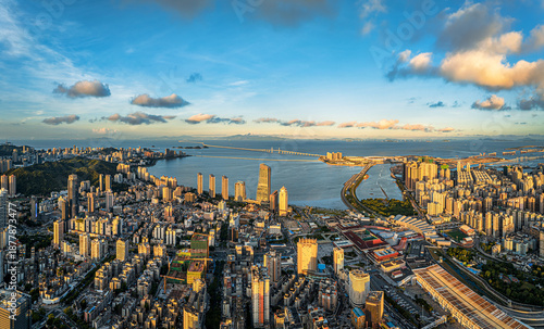 Photos Aerial view of the modern cityscape of Zhuhai with the Hong Kong-Zhuhai-Macao Bridge during sunset in China