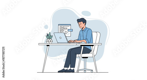 Male software developer working on laptop at desk