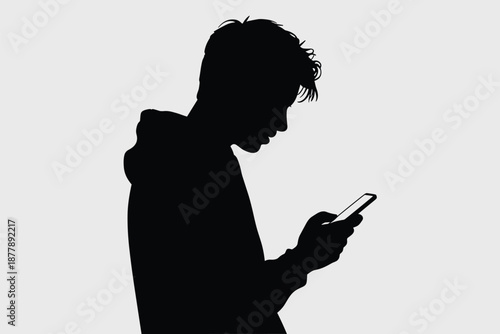 Silhouette of young man using mobile phone for social media communication and digital connection in modern lifestyle concept for technology advertising and online marketing with focus on youth culture