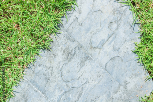 Close-up view of granite laid on grass lawn, creating a natural