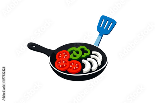 Frying pan with colorful vegetables and spatula