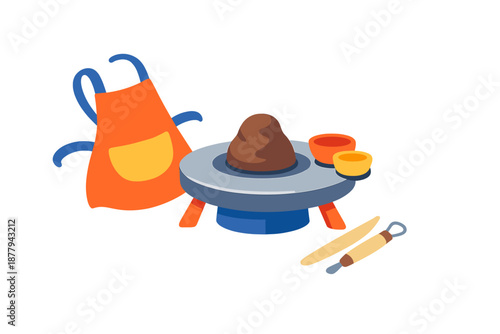 Pottery wheel with clay, apron, bowls and tools