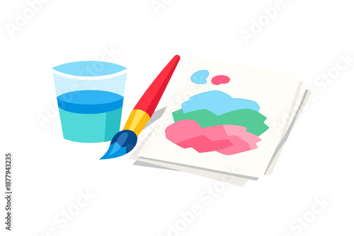 Art supplies with glass of water and painting on paper