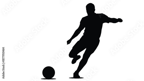 Silhouette of a powerful soccer player kicking a ball ready for competitive sport action