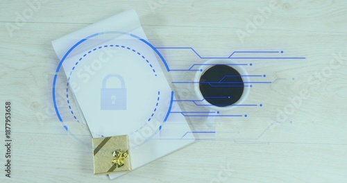 Displaying closed white notebook bearing blue lock overlay on light wood desk, gold gift and coffee