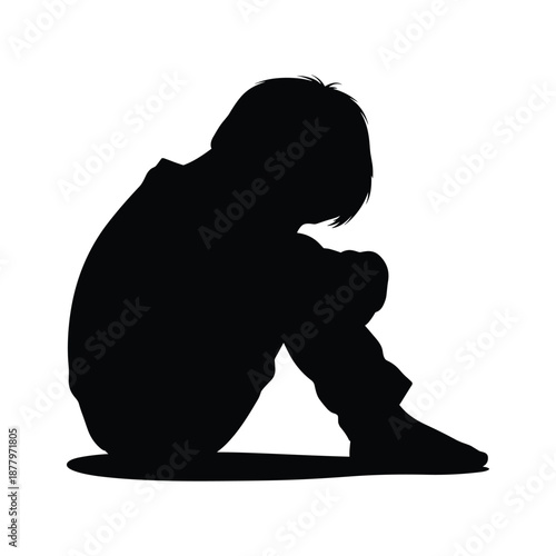 Silhouette of a Sad Child Sitting Alone