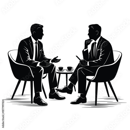 Two businessmen in suits having a serious conversation with coffee