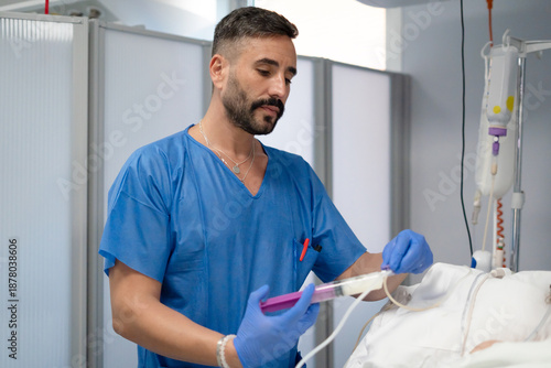 Konstfotografi Nurse administering enteral feeding to a patient in hospital
