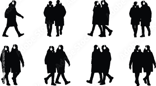 Silhouettes of couples walking with headphones coats