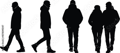 Silhouettes of people walking in winter coats and boots