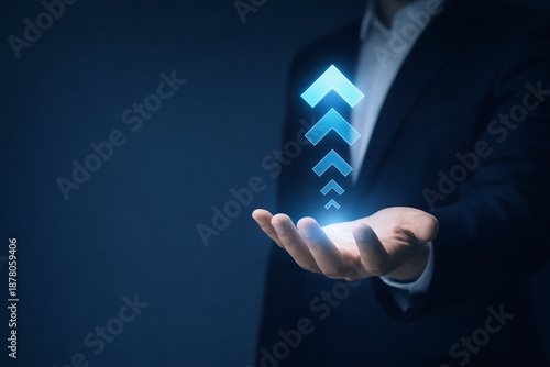 Glowing blue upward arrows concept floating above hand symbolizing career advancement business promotion and continuous personal or corporate growth success