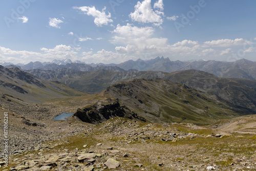 Panoramic view of Lake Roche Noire from Col des Marches, overlooking the Maurienne Valley near Valmeinier in the French Alps