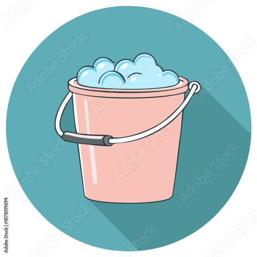 Pink bucket filled with blue soapy water and foam bubbles