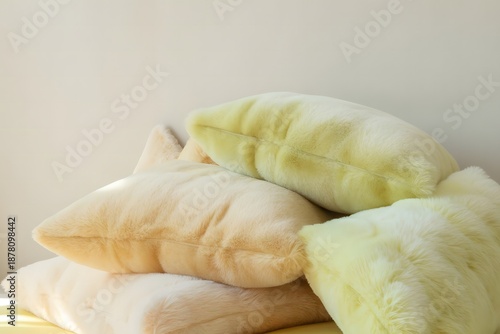 Pile of Soft Pastel Faux Fur Decorative Pillows for a Cozy Home Interior Design Concept