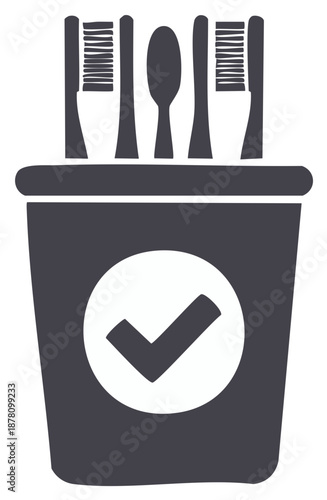 Bathroom cup filled with toothbrushes and tongue scraper featuring a prominent check mark, a simple symbol of complete oral care