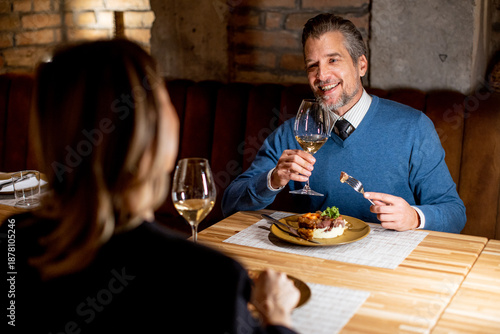 Couple enjoys dinner at a r...