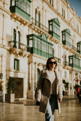 Woman walking in a historic...