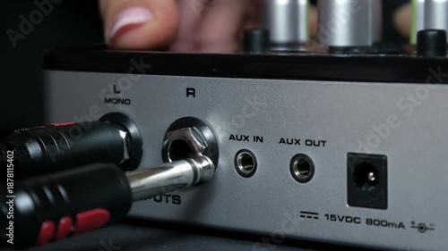 Connecting Audio Cables to Professional Sound Mixer and Microphone, Close-Up
