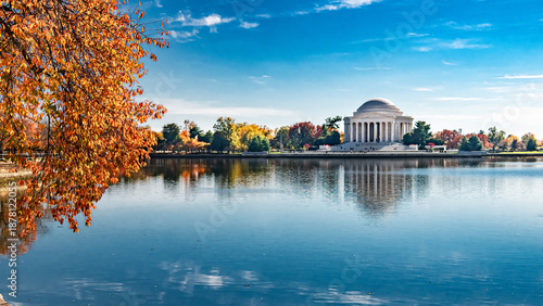 Fotografie Fall foliage and calm water at Tidal Basin with Jefferson Memorial Washington DC