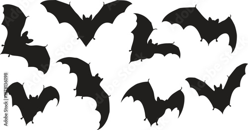 Collection of flying black bat silhouettes on white background silhouette