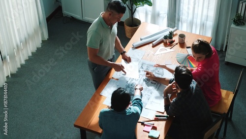 Fotografía Top view of interior designer planing building while project manager working and holding coffee