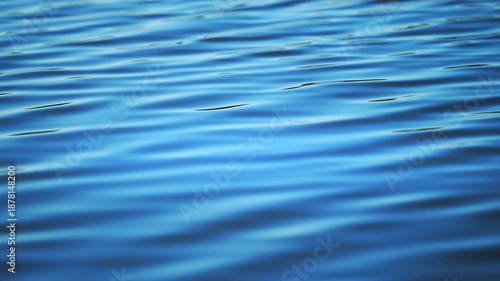 Pure blue water texture with gentle waves, calm abstract nature footage in 4K
