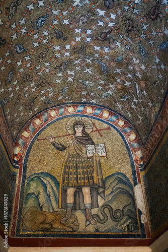 Ravenna, Italy, Early Christian mosaic of Christ as a warrior trampling lion and serpent, with Latin text and floral ceiling above.