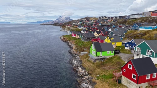 GREENLAND - 11.4.2025 - Incredible aerial footage moving up the coastline of Nuuk, Greenland, filled with colorful houses.