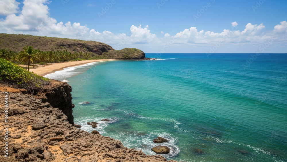 Fototapeta premium Serene coastal landscape with turquoise water and rocky shore against a clear blue sky, ideal for travel-themed promotions in Venezuela.