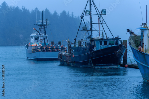 Fishing boats docked in the twilight