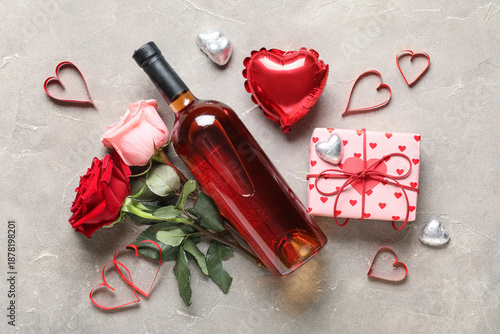 Bottle of wine with rose fl...