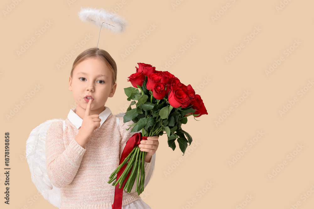 Fototapeta premium Cute little girl dressed as cupid with bouquet of beautiful rose flowers showing silence gesture on beige background. Valentine's Day celebration