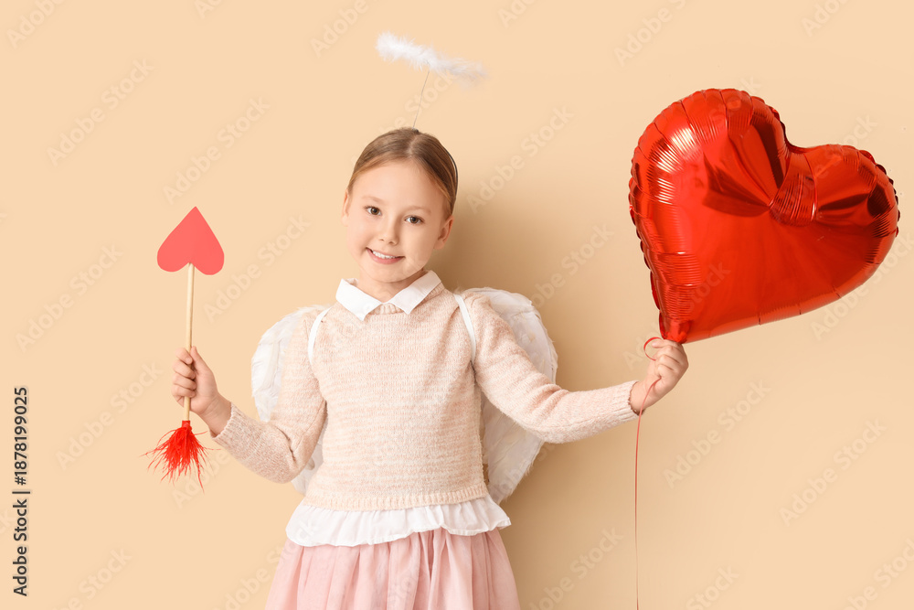 Fototapeta premium Cute little girl dressed as cupid with arrow and air balloon in shape of heart on beige background. Valentine's Day celebration