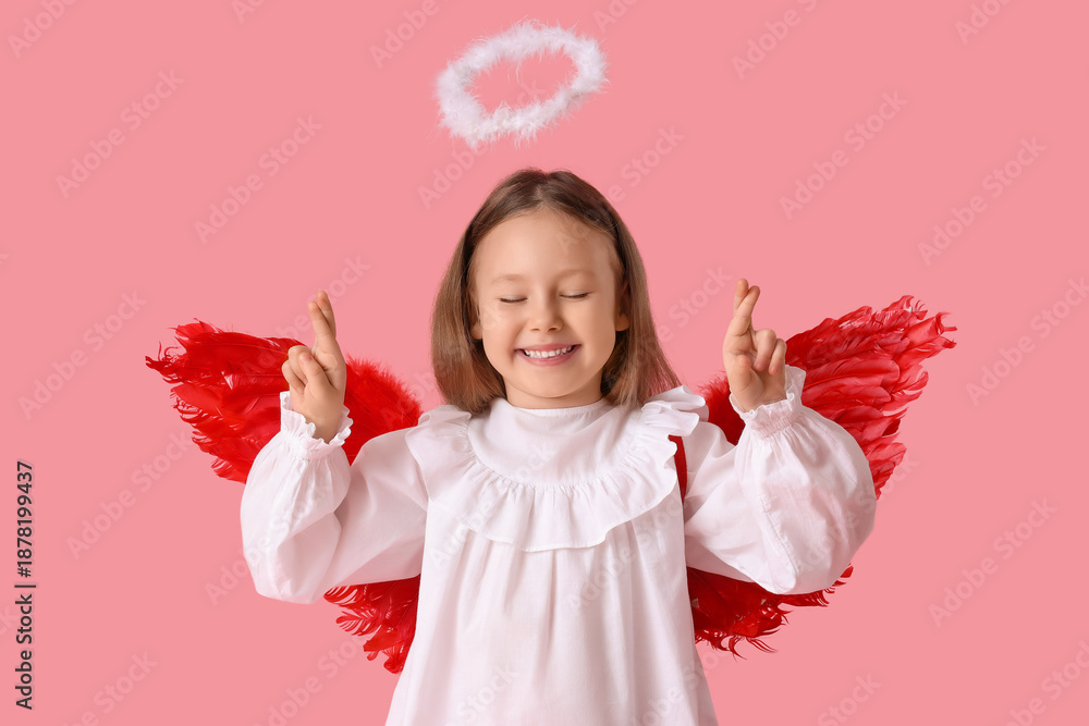 Fototapeta premium Cute little girl dressed as cupid making wish on pink background. Valentine's Day celebration