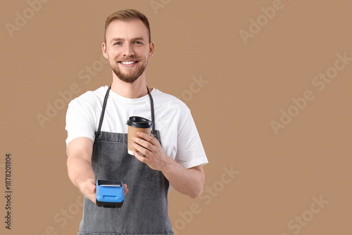 Male barista with coffee cu...